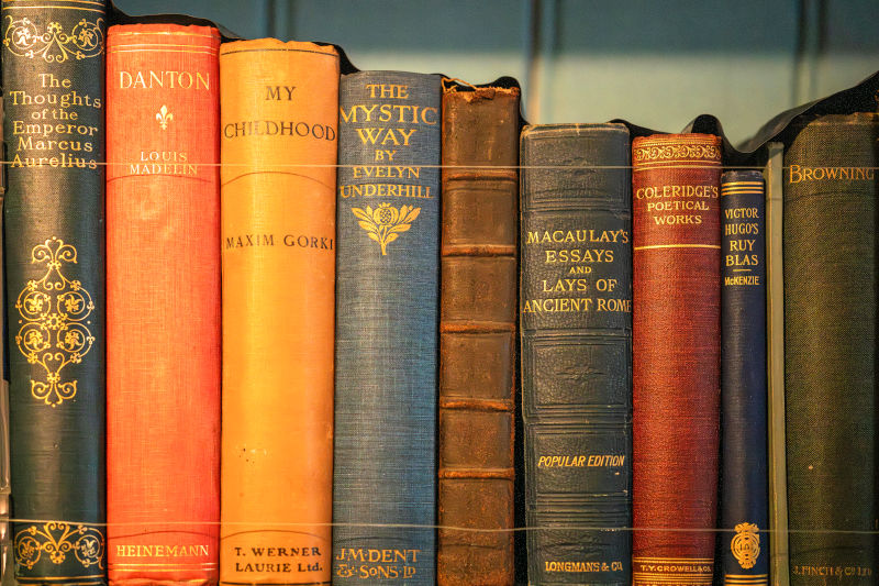 collection of vintage books on shelf